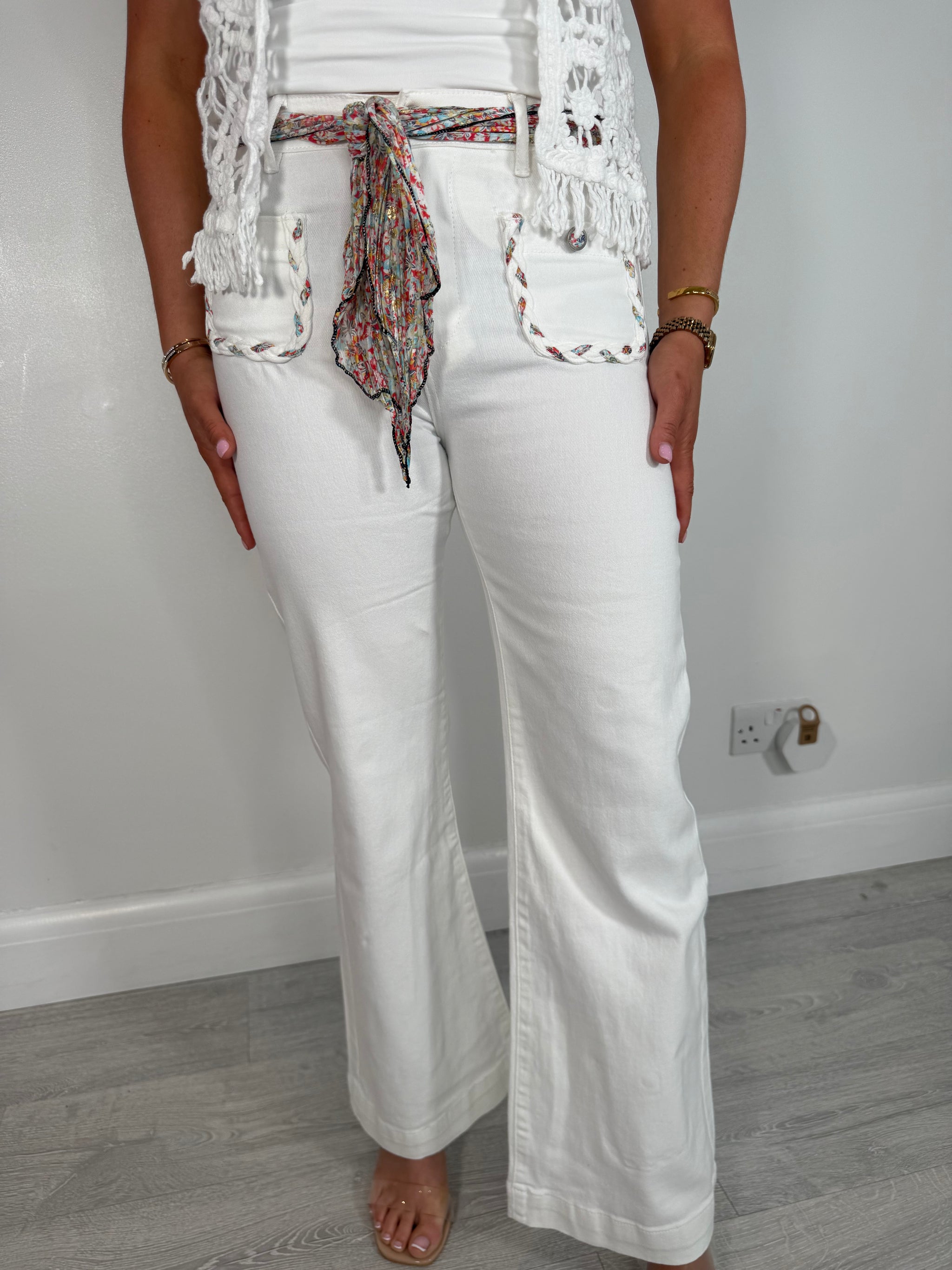 Candice white flared stretch jeans with pocket detailing and scarf belt